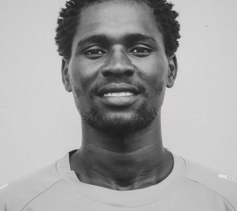 Close-up shot of a person's focused expression during exercise.