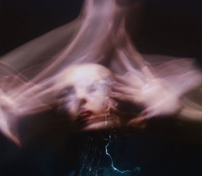 Dynamic motion blur of a person performing a flowing movement.