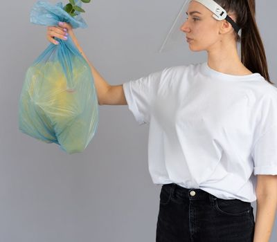 Person holding a balanced pose in a minimalist environment.